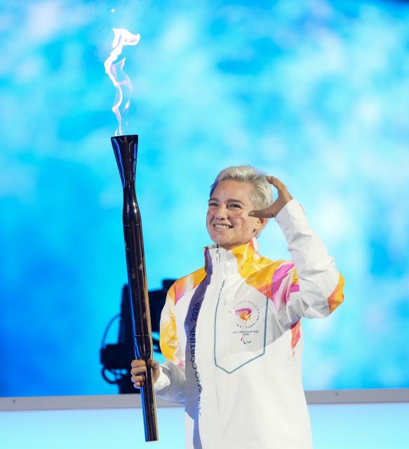 (260307) -- VERONA, March 7, 2026 (Xinhua) -- Torchbearer Bebe Vio is seen during the opening ceremony of Milan-Cortina 2026 Paralympic Winter Games at Verona Olympic Arena in Verona, Italy, March 6, 2026. (Xinhua/Li Jing)