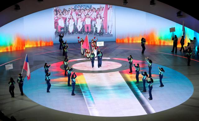 (260307) -- VERONA, March 7, 2026 (Xinhua) -- Members of the delegation of China parade during the opening ceremony of Milan-Cortina 2026 Paralympic Winter Games at Verona Olympic Arena in Verona, Italy, March 6, 2026. (Xinhua/Cai Yang)