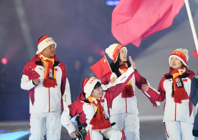 (260307) -- VERONA, March 7, 2026 (Xinhua) -- Members of the delegation of China parade during the opening ceremony of Milan-Cortina 2026 Paralympic Winter Games at Verona Olympic Arena in Verona, Italy, March 6, 2026. (Xinhua/Li Jing)