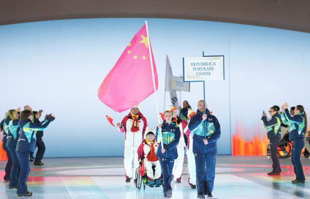 (260307) -- VERONA, March 7, 2026 (Xinhua) -- Members of the delegation of China parade during the opening ceremony of Milan-Cortina 2026 Paralympic Winter Games at Verona Olympic Arena in Verona, Italy, March 6, 2026. (Xinhua/Li Jing)