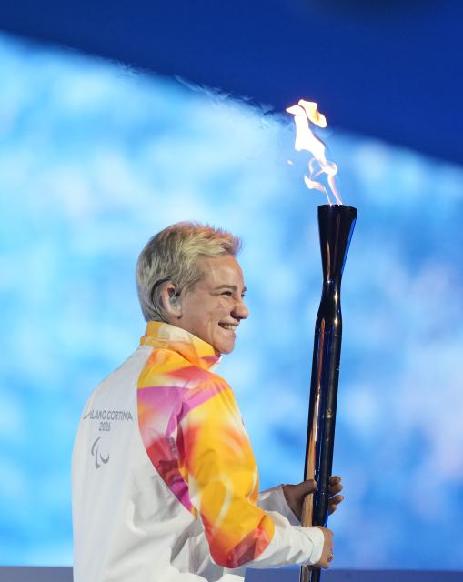 (260307) -- VERONA, March 7, 2026 (Xinhua) -- Torchbearer Bebe Vio is seen during the opening ceremony of Milan-Cortina 2026 Paralympic Winter Games at Verona Olympic Arena in Verona, Italy, March 6, 2026. (Xinhua/Li Jing)