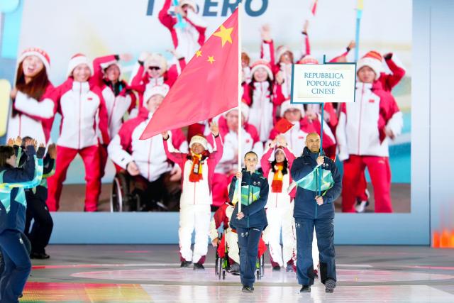 (260307) -- VERONA, March 7, 2026 (Xinhua) -- Members of the delegation of China parade during the opening ceremony of Milan-Cortina 2026 Paralympic Winter Games at Verona Olympic Arena in Verona, Italy, March 6, 2026. (Xinhua/Li Jing)
