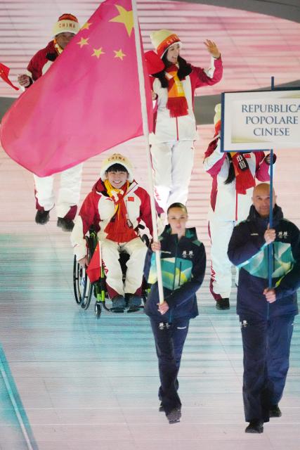 (260307) -- VERONA, March 7, 2026 (Xinhua) -- Members of the delegation of China parade during the opening ceremony of Milan-Cortina 2026 Paralympic Winter Games at Verona Olympic Arena in Verona, Italy, March 6, 2026. (Xinhua/Cai Yang)