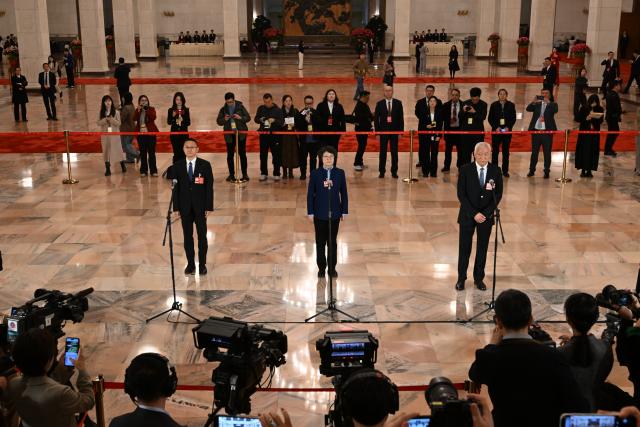 (260307) -- BEIJING, March 7, 2026 (Xinhua) -- Members of the 14th National Committee of the Chinese People's Political Consultative Conference (CPPCC) attend a group interview ahead of the second plenary meeting of the fourth session of the 14th CPPCC National Committee at the Great Hall of the People in Beijing, capital of China, March 7, 2026. (Xinhua/Cao Yiming)