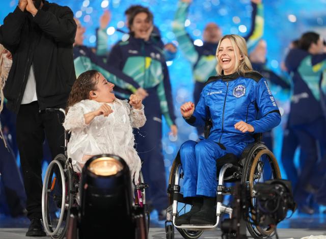 (260307) -- VERONA, March 7, 2026 (Xinhua) -- Astronaut Michaela Benthaus (R) is seen during the opening ceremony of Milan-Cortina 2026 Paralympic Winter Games at Verona Olympic Arena in Verona, Italy, March 6, 2026. (Xinhua/Li Jing)