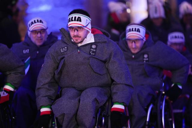 (260307) -- VERONA, March 7, 2026 (Xinhua) -- Members of the delegation of Italy parade during the opening ceremony of Milan-Cortina 2026 Paralympic Winter Games at Verona Olympic Arena in Verona, Italy, March 6, 2026. (Xinhua/Li Jing)
