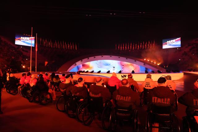 (260307) -- VERONA, March 7, 2026 (Xinhua) -- Athletes watch the opening ceremony of Milan-Cortina 2026 Paralympic Winter Games at Verona Olympic Arena in Verona, Italy, March 6, 2026. (Xinhua/Li Jing)