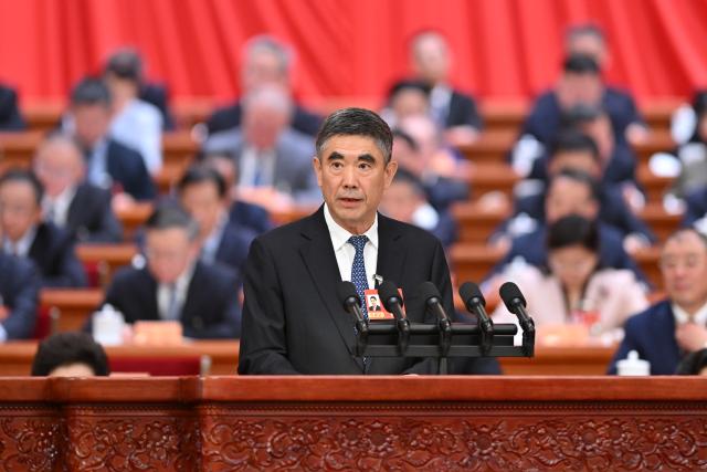 (260307) -- BEIJING, March 7, 2026 (Xinhua) -- Wang Jianjun, a member of the 14th National Committee of the Chinese People's Political Consultative Conference (CPPCC), speaks at the second plenary meeting of the fourth session of the 14th CPPCC National Committee at the Great Hall of the People in Beijing, capital of China, March 7, 2026. (Xinhua/Liu Weibing)