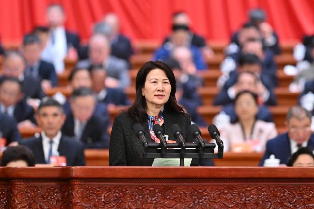 (260307) -- BEIJING, March 7, 2026 (Xinhua) -- Huo Jinhua, a member of the 14th National Committee of the Chinese People's Political Consultative Conference (CPPCC), speaks at the second plenary meeting of the fourth session of the 14th CPPCC National Committee at the Great Hall of the People in Beijing, capital of China, March 7, 2026. (Xinhua/Liu Weibing)