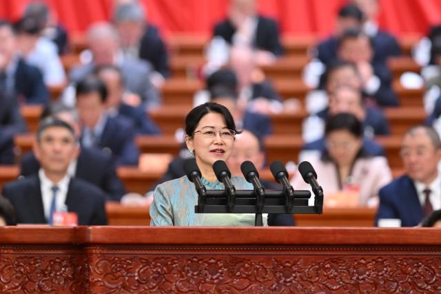(260307) -- BEIJING, March 7, 2026 (Xinhua) -- He Dan, a member of the 14th National Committee of the Chinese People's Political Consultative Conference (CPPCC), speaks at the second plenary meeting of the fourth session of the 14th CPPCC National Committee at the Great Hall of the People in Beijing, capital of China, March 7, 2026. (Xinhua/Yue Yuewei)