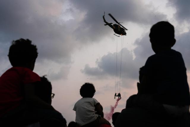 (260307) -- COLOMBO, March 7, 2026 (Xinhua) -- People attend the exhibition and air show to mark the 75th anniversary of the Sri Lanka Air Force in Colombo, Sri Lanka, on March 6, 2026. (Photo by Thilina Kaluthotage/Xinhua)