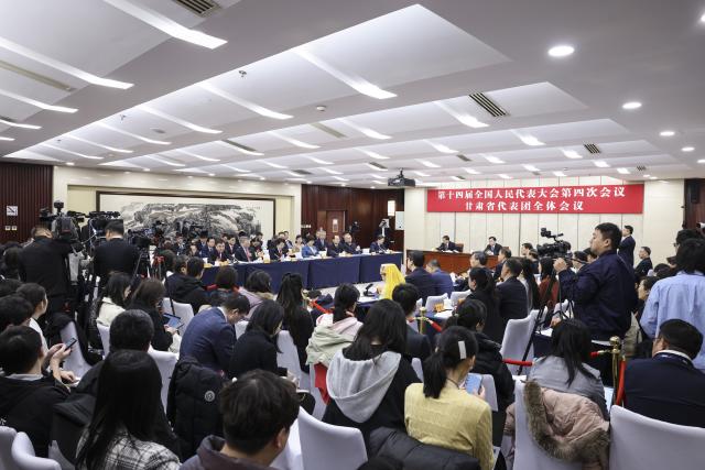 (260307) -- BEIJING, March 7, 2026 (Xinhua) -- A group meeting of deputies from the delegation of Gansu Province is held at the fourth session of the 14th National People's Congress (NPC) in Beijing, capital of China, March 7, 2026. (Xinhua/Jin Liwang)