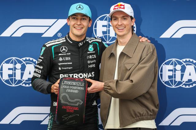 (260307) -- MELBOURNE, March 7, 2026 (Xinhua) -- Scotty James, Australian winter olympic silver medalist, presents Pole Position Award to Mercedes' George Russell (L) of Britain after the qualifying session of the Formula One Australia Grand Prix at Albert Park in Melbourne, Australia, March 7, 2026. (Photo by Qian Jun/Xinhua)