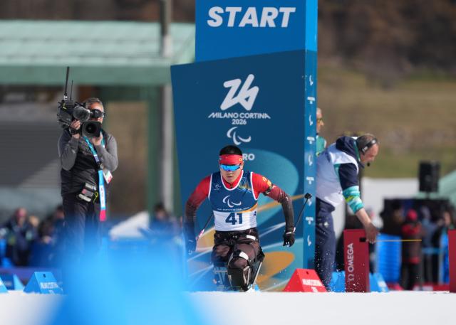 (260307) -- TESERO, March 7, 2026 (Xinhua) -- Wang Tao of China competes during the men's sprint sitting final of para biathon at the Milan-Cortina 2026 Paralympic Winter Games in Tesero, Italy, March 7, 2026. (Xinhua/Hou Zhaokang)