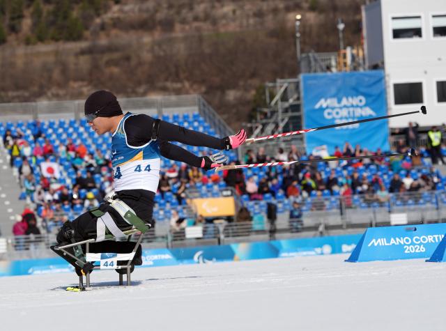 (260307) -- TESERO, March 7, 2026 (Xinhua) -- Liu Zixu of China competes during the men's sprint sitting final of para biathon at the Milan-Cortina 2026 Paralympic Winter Games in Tesero, Italy, March 7, 2026. (Xinhua/Hou Zhaokang)
