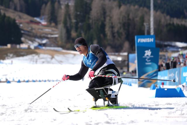 (260307) -- TESERO, March 7, 2026 (Xinhua) -- Liu Zixu of China reacts after the men's sprint sitting final of para biathon at the Milan-Cortina 2026 Paralympic Winter Games in Tesero, Italy, March 7, 2026. (Xinhua/Hou Zhaokang)