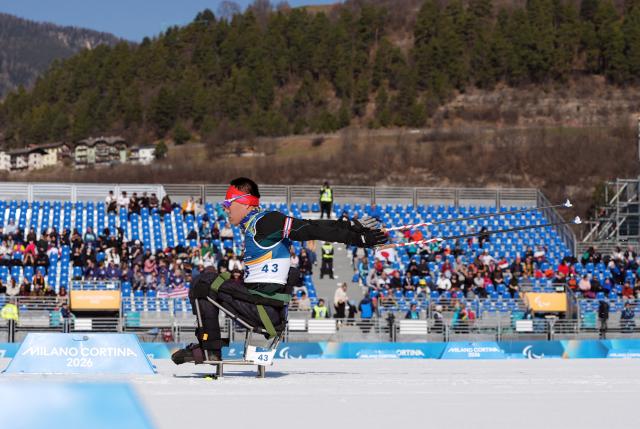 (260307) -- TESERO, March 7, 2026 (Xinhua) -- Mao Zhongwu of China competes during the men's sprint sitting final of para biathon at the Milan-Cortina 2026 Paralympic Winter Games in Tesero, Italy, March 7, 2026. (Xinhua/Hou Zhaokang)