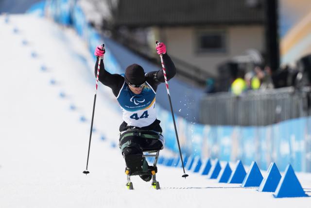 (260307) -- TESERO, March 7, 2026 (Xinhua) -- Liu Zixu of China competes during the men's sprint sitting final of para biathon at the Milan-Cortina 2026 Paralympic Winter Games in Tesero, Italy, March 7, 2026. (Xinhua/Hou Zhaokang)