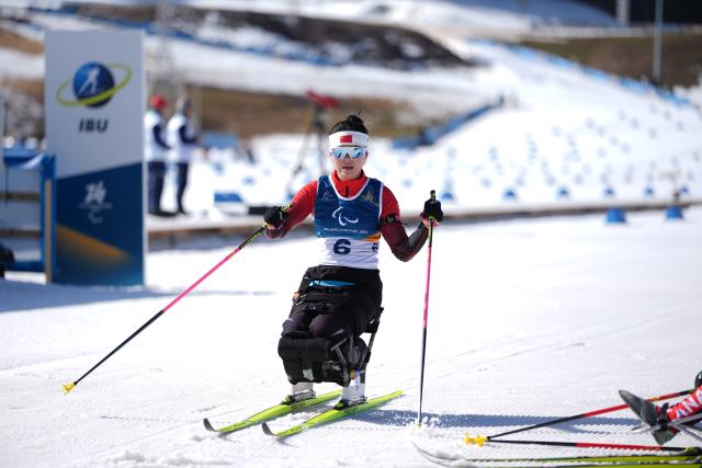 (260307) -- TESERO, March 7, 2026 (Xinhua) -- Shan Yilin of China reacts after the women's sprint sitting final of para biathon at the Milan-Cortina 2026 Paralympic Winter Games in Tesero, Italy, March 7, 2026. (Xinhua/Hou Zhaokang)