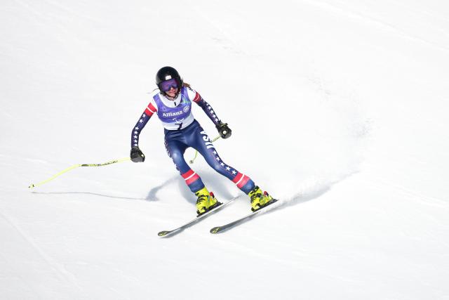 (260307) -- CORTINA D'AMPEZZO, March 7, 2026 (Xinhua) -- Meg Gustafson of the United States competes during para alpine skiing women's downhill vision impaired match at the Milan-Cortina 2026 Paralympic Winter Games in Cortina D'ampezzo, Italy, March 7, 2026. (Xinhua/Wang Kaiyan)