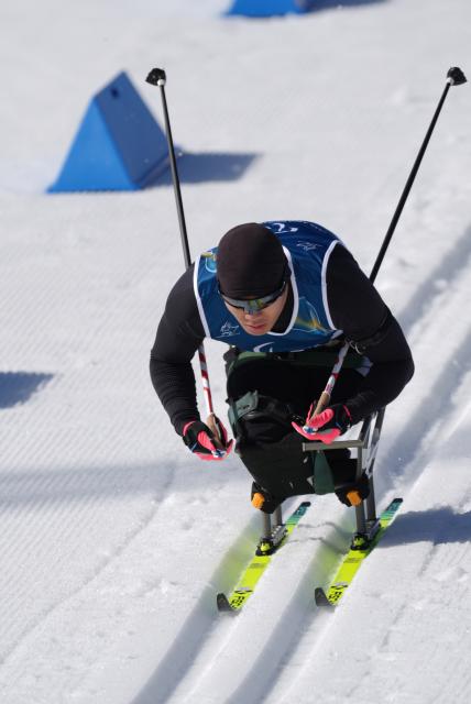 (260307) -- TESERO, March 7, 2026 (Xinhua) -- Liu Zixu of China competes during the men's sprint sitting final of para biathon at the Milan-Cortina 2026 Paralympic Winter Games in Tesero, Italy, March 7, 2026. (Xinhua/Cai Yang)
