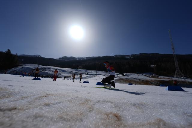 (260307) -- TESERO, March 7, 2026 (Xinhua) -- Wang Tao of China competes during the men's sprint sitting final of para biathon at the Milan-Cortina 2026 Paralympic Winter Games in Tesero, Italy, March 7, 2026. (Xinhua/Cai Yang)