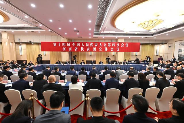 (260307) -- BEIJING, March 7, 2026 (Xinhua) -- A group meeting of deputies from the delegation of Henan Province is held at the fourth session of the 14th National People's Congress (NPC) in Beijing, capital of China, March 7, 2026. (Xinhua/Li Xin)