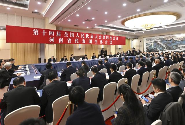 (260307) -- BEIJING, March 7, 2026 (Xinhua) -- A group meeting of deputies from the delegation of Henan Province is held at the fourth session of the 14th National People's Congress (NPC) in Beijing, capital of China, March 7, 2026. (Xinhua/Li Xin)