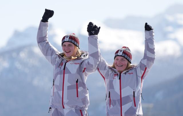 (260307) -- CORTINA D'AMPEZZO, March 7, 2026 (Xinhua) -- Veronika Aigner (L) of Austria celebrates with her guide during the awarding ceremony for para alpine skiing women's downhill vision impaired match at the Milan-Cortina 2026 Paralympic Winter Games in Cortina D'ampezzo, Italy, March 7, 2026. (Xinhua/Wang Kaiyan)