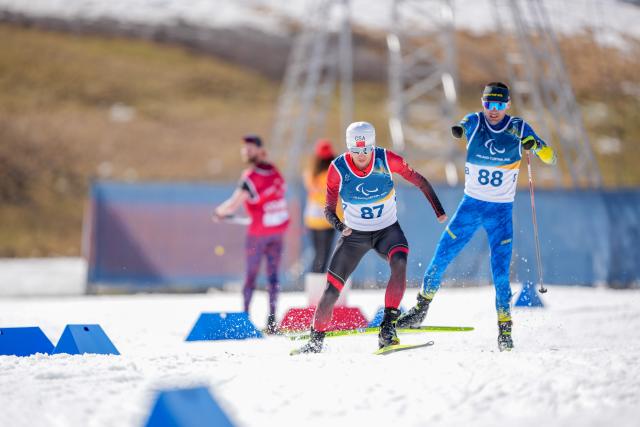 (260307) -- TESERO, March 7, 2026 (Xinhua) -- Liu Xiaobin (L) of China competes during the men's sprint standing final of para biathon at the Milan-Cortina 2026 Paralympic Winter Games in Tesero, Italy, March 7, 2026. (Xinhua/Lian Zhen)