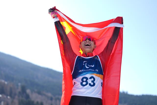 (260307) -- TESERO, March 7, 2026 (Xinhua) -- Cai Jiayun of China celebrates after winning the men's sprint standing final of para biathon at the Milan-Cortina 2026 Paralympic Winter Games in Tesero, Italy, March 7, 2026. (Xinhua/Hou Zhaokang)