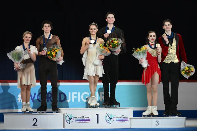 (260307) -- TALLINN, March 7, 2026 (Xinhua) -- Silver medalists Ambre Perrier Gianesini/Samuel Blanc Klaperman of France, Gold medalists Hana Maria Aboian/Daniil Veselukhin of the United States and bronze medalists Iryna Pidgaina/Artem Koval of Ukraine (From L to R) pose for photos during the award ceremony for the free dance of Ice Dance at ISU Figure Skating Junior World Championships in Tallinn, Estonia, March 7, 2026. (Photo by Sergei Stepanov/Xinhua)