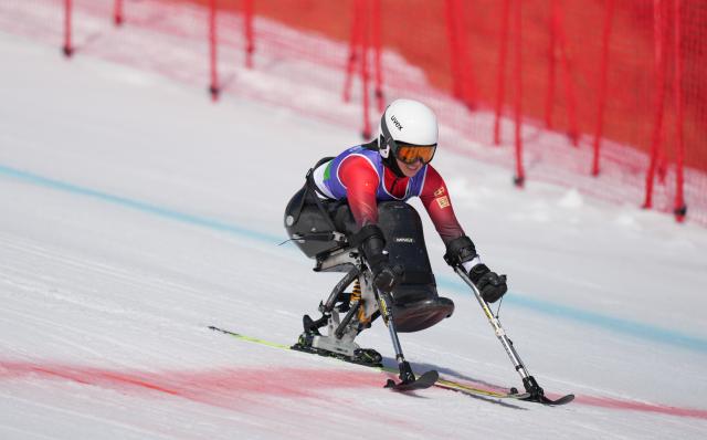 (260307) -- CORTINA D'AMPEZZO, March 7, 2026 (Xinhua) -- Zhang Wenjing of China competes during the para alpine skiing women's downhill sitting match at the Milan-Cortina 2026 Paralympic Winter Games in Cortina D'ampezzo, Italy, March 7, 2026. (Xinhua/Wang Kaiyan)