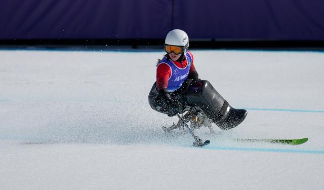 (260307) -- CORTINA D'AMPEZZO, March 7, 2026 (Xinhua) -- Zhang Wenjing of China competes during the para alpine skiing women's downhill sitting match at the Milan-Cortina 2026 Paralympic Winter Games in Cortina D'ampezzo, Italy, March 7, 2026. (Xinhua/Wang Kaiyan)
