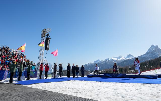 (260307) -- CORTINA D'AMPEZZO, March 7, 2026 (Xinhua) -- Anna-Lena Forster (2nd R) of Germany, Audrey Pascual Seco (3rd R) of Spain, Liu Sitong (1st R) of China react during awarding ceremony for the para alpine skiing women's downhill sitting match at the Milan-Cortina 2026 Paralympic Winter Games in Cortina D'ampezzo, Italy, March 7, 2026. (Xinhua/Wang Kaiyan)