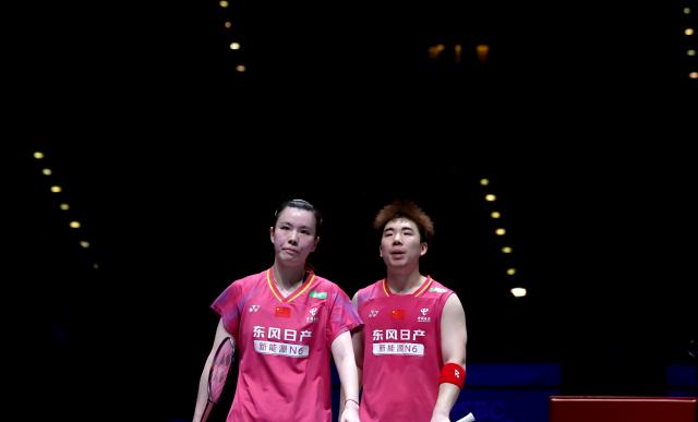 (260307) -- BIRMINGHAM, March 7, 2026 (Xinhua) -- Guo Xinwa (R)/Chen Fanghui react during the mixed doubles semifinal between Guo Xinwa/Chen Fanghui of China and Thom Gicquel/Delphine Delrue of France at the All England Open Badminton Championships 2026 in Birmingham, Britain, March 7, 2026. (Xinhua/Li Ying)