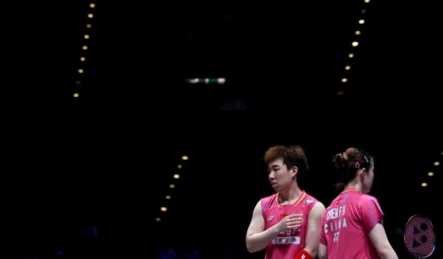 (260307) -- BIRMINGHAM, March 7, 2026 (Xinhua) -- Guo Xinwa (L)/Chen Fanghui react during the mixed doubles semifinal between Guo Xinwa/Chen Fanghui of China and Thom Gicquel/Delphine Delrue of France at the All England Open Badminton Championships 2026 in Birmingham, Britain, March 7, 2026. (Xinhua/Li Ying)