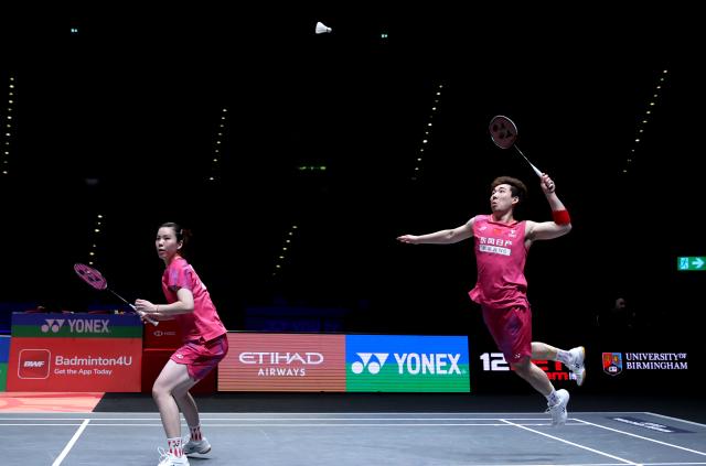 (260307) -- BIRMINGHAM, March 7, 2026 (Xinhua) -- Guo Xinwa (R)/Chen Fanghui compete during the mixed doubles semifinal between Guo Xinwa/Chen Fanghui of China and Thom Gicquel/Delphine Delrue of France at the All England Open Badminton Championships 2026 in Birmingham, Britain, March 7, 2026. (Xinhua/Li Ying)