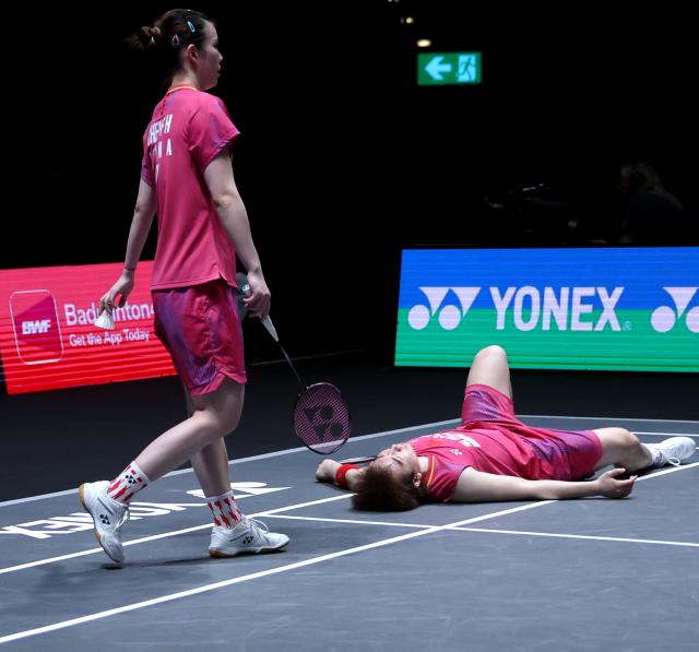 (260307) -- BIRMINGHAM, March 7, 2026 (Xinhua) -- Guo Xinwa (R)/Chen Fanghui react during the mixed doubles semifinal between Guo Xinwa/Chen Fanghui of China and Thom Gicquel/Delphine Delrue of France at the All England Open Badminton Championships 2026 in Birmingham, Britain, March 7, 2026. (Xinhua/Li Ying)