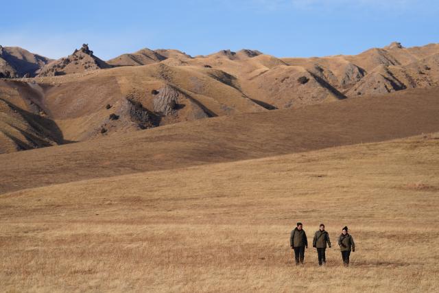 (260308) -- BEIJING, March 8, 2026 (Xinhua) -- Female rangers walk back to the Qingyanggou protection station in the Qinghai section of Qilian Mountains National Park, in Qilian County, northwest China's Qinghai Province, March 6, 2026. (Xinhua/Zhang Long)