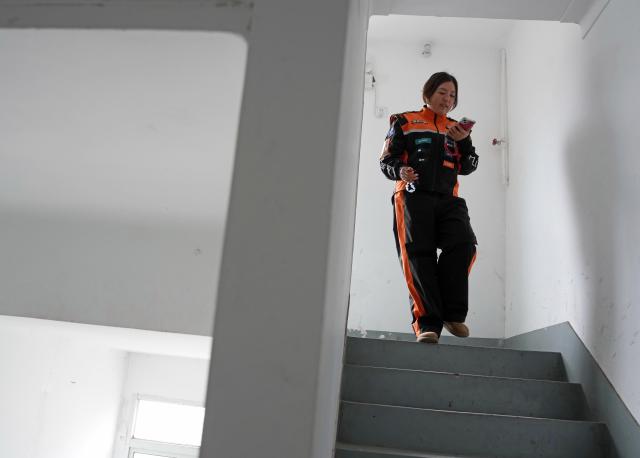 (260307) -- SHANGHAI, March 7, 2026 (Xinhua) -- Tian Dan leaves home for work in Shanghai, east China, on March 4, 2026.
  Tian Dan, 37, is a delivery worker and mother of two. In 2021, Tian left her hometown in Hanzhong of northwest China's Shaanxi Province, to work as a delivery rider in Shanghai. In her early days on the job, she faced setbacks such as getting lost and falling off her motorbike. But with perseverance, she gradually grew and came to realize the value of her profession.  
  In 2024, Tian signed up for the country's continuing education initiative, which is designed to help working individuals to pursue further education, and became one of the first batch of delivery riders to attend university for free. Today, she has graduated from junior college and enrolled to pursue a bachelor's degree.
  Recently, the 37-year-old was awarded China's 2025 March 8th Red-Banner Individual Holder, one of the highest honors given to the country's outstanding women by the All-China Women's Federation.
  After receiving the national honor, Tian is aware of greater responsibilities she should shoulder to help more riders in their work, life and development. (Xinhua/Liu Ying)