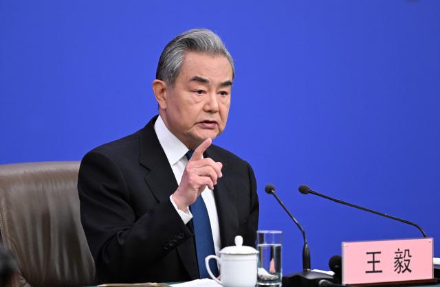 (260308) -- BEIJING, March 8, 2026 (Xinhua) -- Chinese Foreign Minister Wang Yi, also a member of the Political Bureau of the Communist Party of China Central Committee, attends a press conference on China's foreign policy and external relations on the sidelines of the fourth session of the 14th National People's Congress (NPC) in Beijing, capital of China, March 8, 2026. (Xinhua/Cao Yiming)