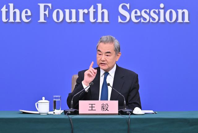 (260308) -- BEIJING, March 8, 2026 (Xinhua) -- Chinese Foreign Minister Wang Yi, also a member of the Political Bureau of the Communist Party of China Central Committee, attends a press conference on China's foreign policy and external relations on the sidelines of the fourth session of the 14th National People's Congress (NPC) in Beijing, capital of China, March 8, 2026. (Xinhua/Li Xin)