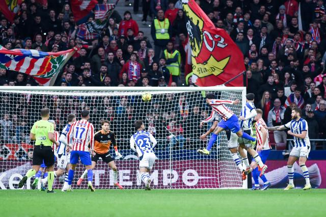 (260308) -- MADRID, March 8, 2026 (Xinhua) -- Atletico de Madrid's Nicolas Gonzalez (top) scores during the La Liga football match between Atletico de Madrid and Real Sociedad at Riyadh Air Metropolitano stadium in Madrid, Spain, on March 7, 2026. (Photo by Gustavo Valiente/Xinhua)