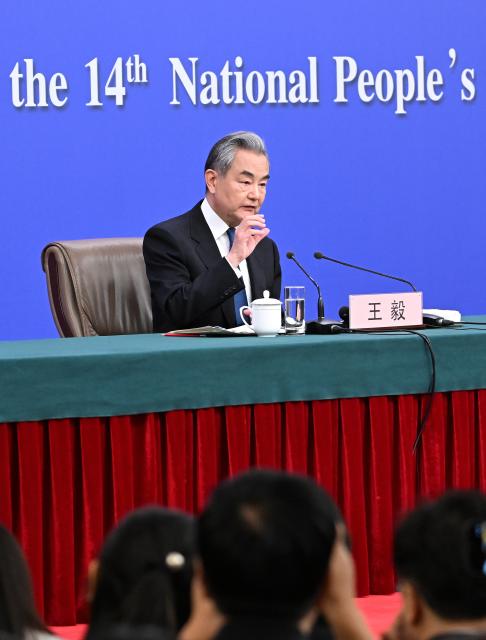 (260308) -- BEIJING, March 8, 2026 (Xinhua) -- Chinese Foreign Minister Wang Yi, also a member of the Political Bureau of the Communist Party of China Central Committee, attends a press conference on China's foreign policy and external relations on the sidelines of the fourth session of the 14th National People's Congress (NPC) in Beijing, capital of China, March 8, 2026. (Xinhua/Cao Yiming)