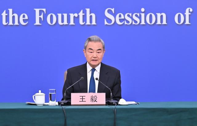 (260308) -- BEIJING, March 8, 2026 (Xinhua) -- Chinese Foreign Minister Wang Yi, also a member of the Political Bureau of the Communist Party of China Central Committee, attends a press conference on China's foreign policy and external relations on the sidelines of the fourth session of the 14th National People's Congress (NPC) in Beijing, capital of China, March 8, 2026. (Xinhua/Li Xin)