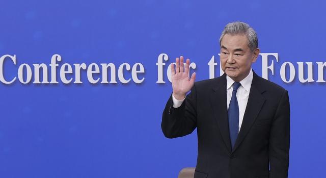 (260308) -- BEIJING, March 8, 2026 (Xinhua) -- Chinese Foreign Minister Wang Yi, also a member of the Political Bureau of the Communist Party of China Central Committee, waves after a press conference on China's foreign policy and external relations on the sidelines of the fourth session of the 14th National People's Congress (NPC) in Beijing, capital of China, March 8, 2026. (Xinhua/Wang Xi)