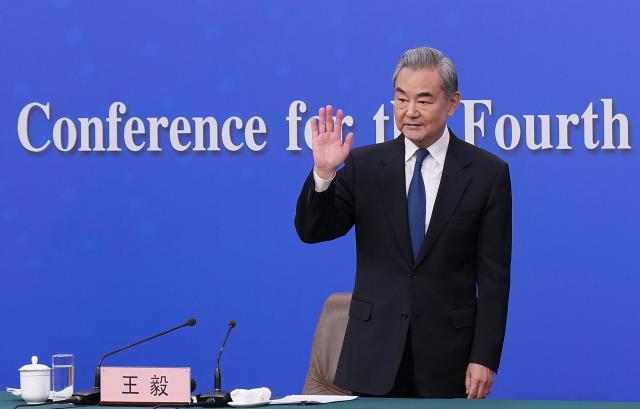 (260308) -- BEIJING, March 8, 2026 (Xinhua) -- Chinese Foreign Minister Wang Yi, also a member of the Political Bureau of the Communist Party of China Central Committee, waves after a press conference on China's foreign policy and external relations on the sidelines of the fourth session of the 14th National People's Congress (NPC) in Beijing, capital of China, March 8, 2026. (Xinhua/Wang Xi)