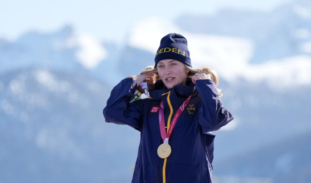 (260308) -- CORTINA D'AMPEZZO, March 8, 2026 (Xinhua) -- Gold medalist Ebba Aarsjoe of Sweden reacts during the awarding ceremony after the para alpine skiing women's downhill standing match at the Milan-Cortina 2026 Paralympic Winter Games in Cortina D'ampezzo, Italy, March 7, 2026. (Xinhua/Wang Kaiyan)