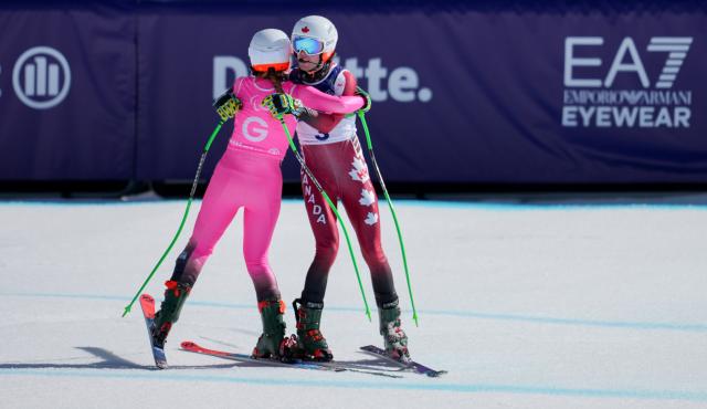 (260308) -- CORTINA D'AMPEZZO, March 8, 2026 (Xinhua) -- Kalle Ericsson (R) of Canada hugs his guide Sierra Smith during the para alpine skiing men's downhill vision impaired match at the Milan-Cortina 2026 Paralympic Winter Games in Cortina D'ampezzo, Italy, March 7, 2026. (Xinhua/Wang Kaiyan)